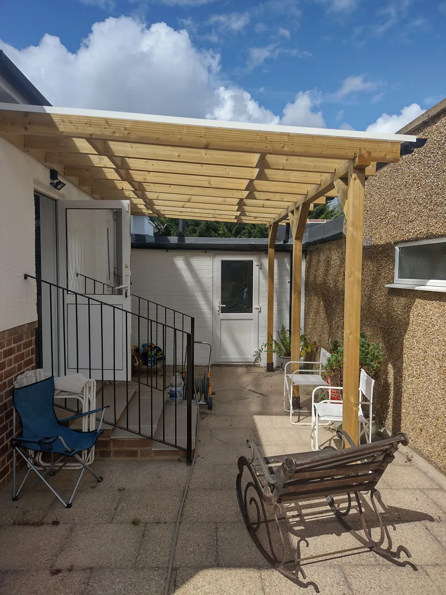 Timber pergola covering a paved patio area